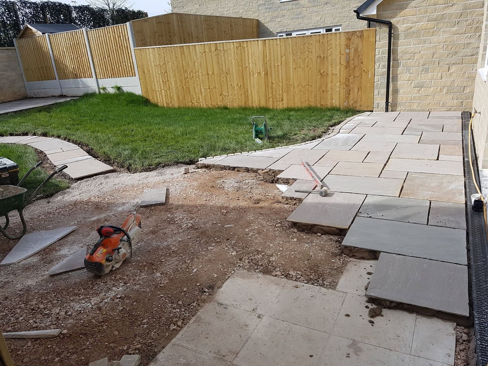 Sandstone flags being laid for a patio